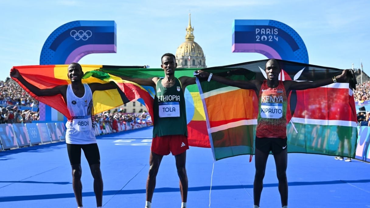 Tamirat Tola, Bashir Abdi et Benson Kipruto.