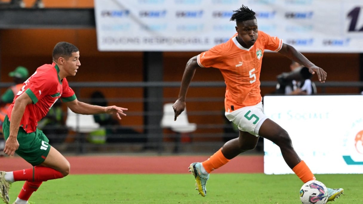 Wilfried Singo et Amine Harit.