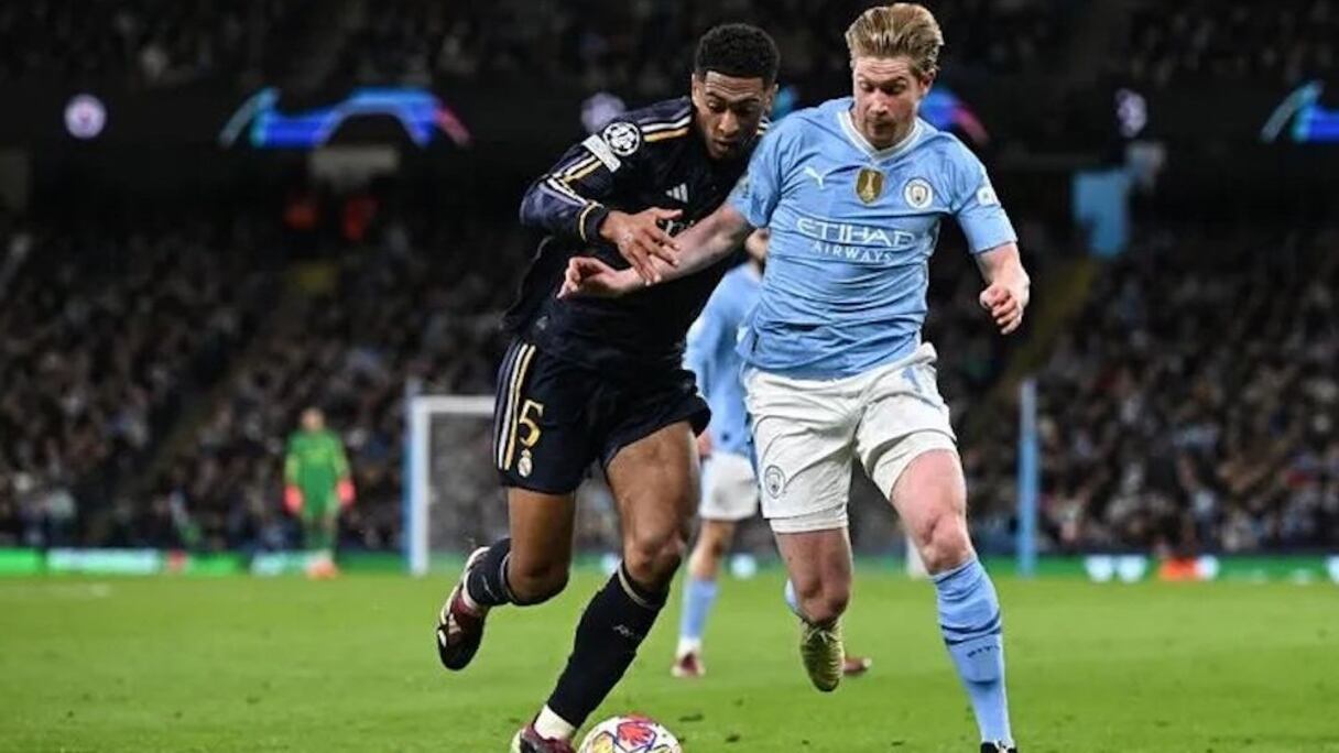 Kevin de Bruyne aux prises avec Jude Bellingham, lors de Manchester City-Real Madrid, le 17 avril 2024.