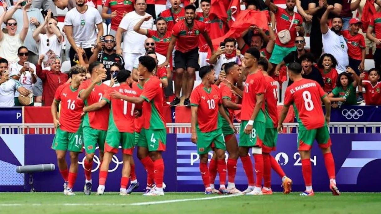 Les Lionceaux de l'Atlas célébrant leur victoire contre l'Irak, le 30 juillet 2024.