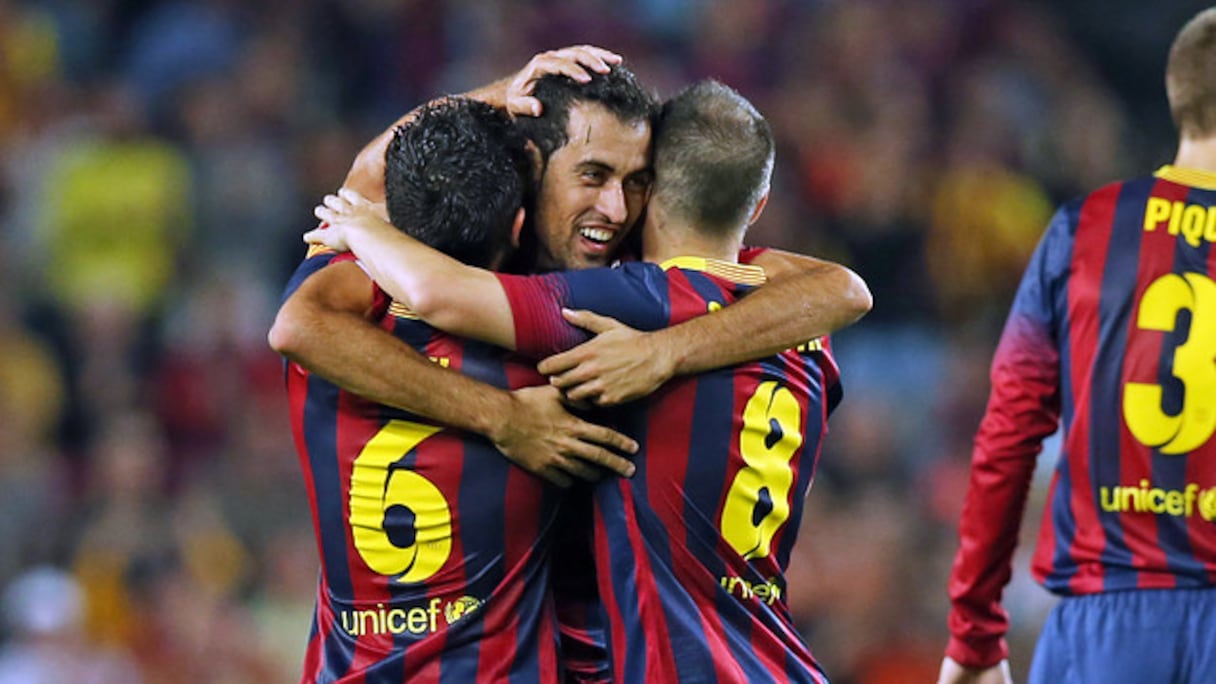 Xavi, Iniesta et Busquets sous les couleurs du Barça.