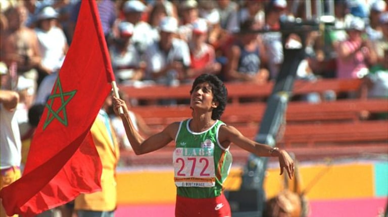 Née le 15 avril 1962 à Casablanca, Nawal Moutawakil a remporté la médaille d'or du premier 400m haies féminin de l'histoire des jeux olympiques, à Los Angeles en 1984. Sur le plan politique, elle a été ministre de la jeunesse et des sports sous le gouvernement d'Abass el Fassi. La première femme dans le monde arabe à occuper ce poste. Nawal est actuellement membre du bureau exécutif et vice-présidente du Comité International olympique. Elle a été présidente de la commission de coordination des jeux olympiques de Rio 2016. 
