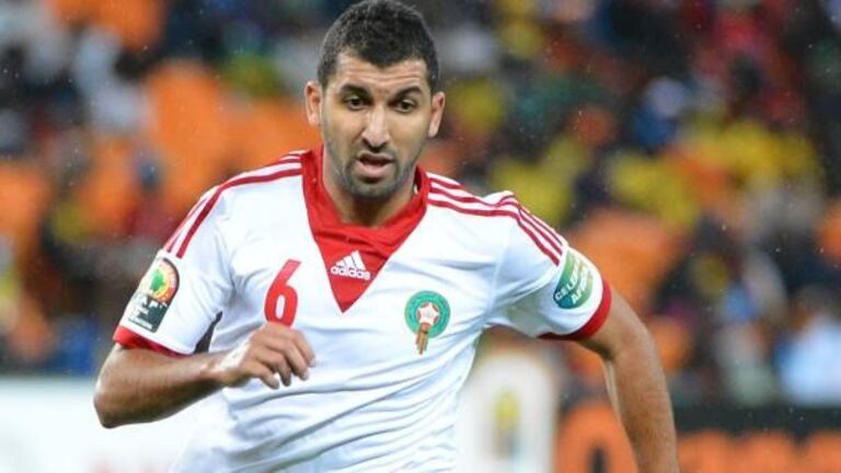 Adil Hermach, international marocain de Nîmes en 2e division française. Il évolue au poste milieu de terrain et compte 23 sélections depuis 2008.